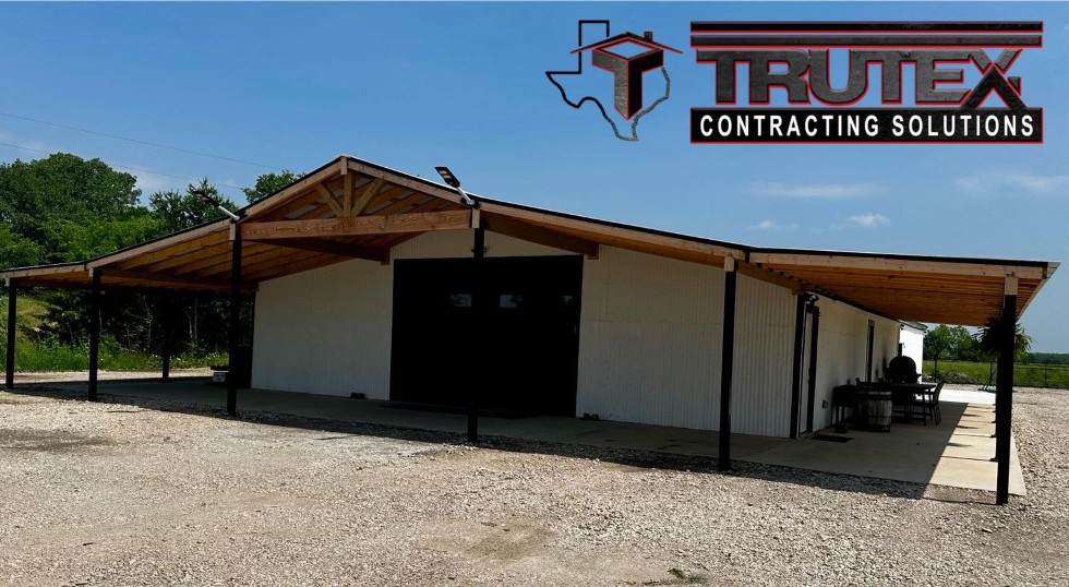 New garage installed on wooden style home by Trutex