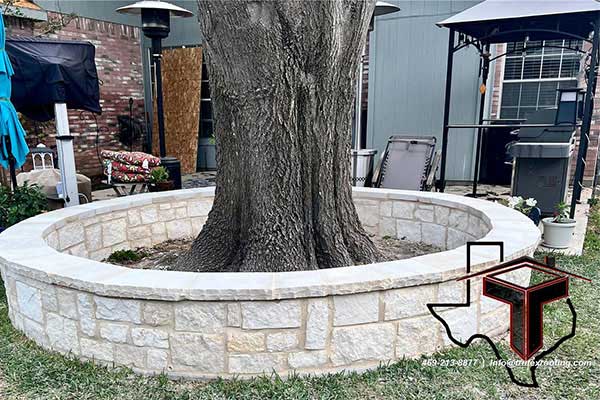 Close up of a circular concrete wall installed by Trutex around a large tree